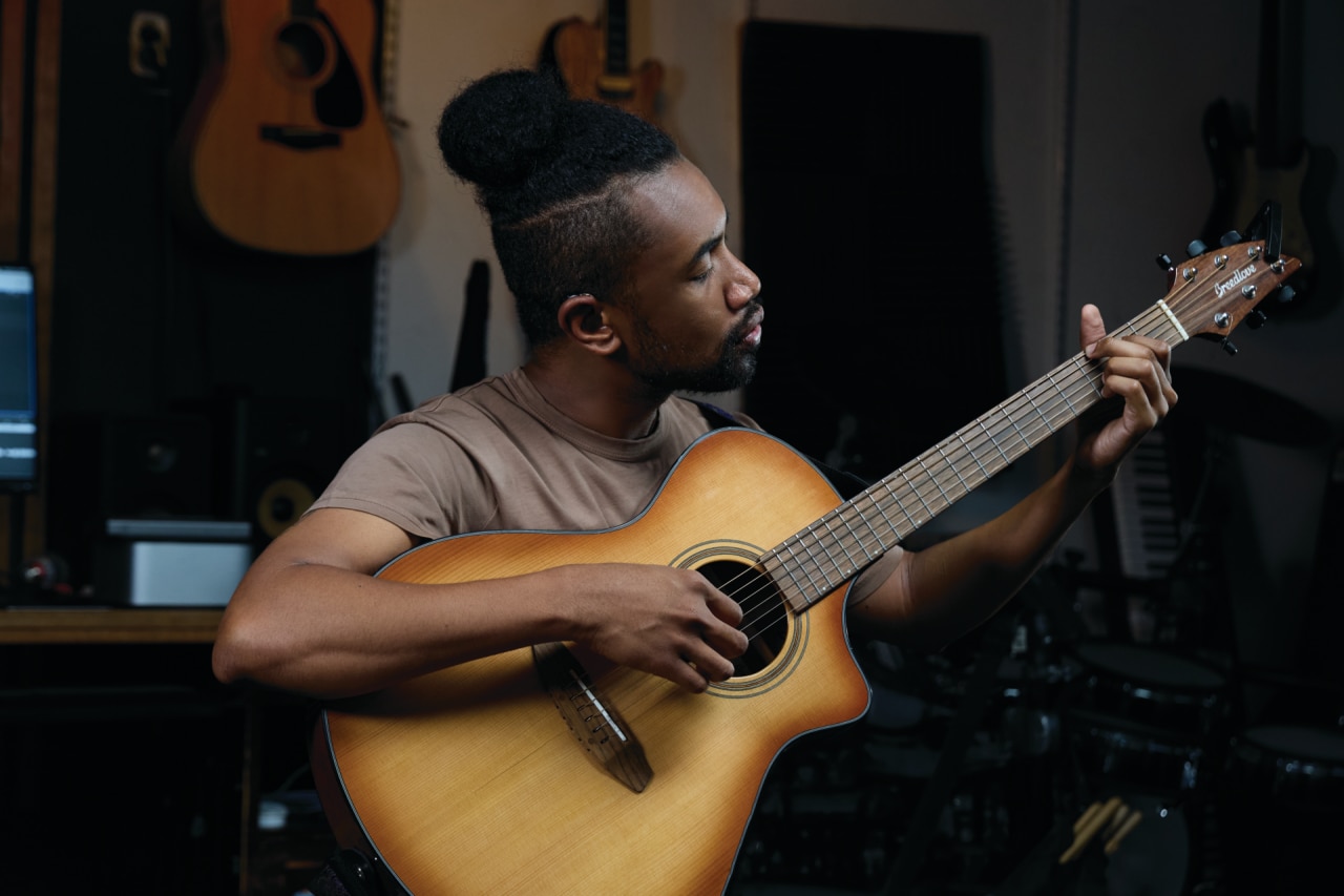 Veteran playing guitar