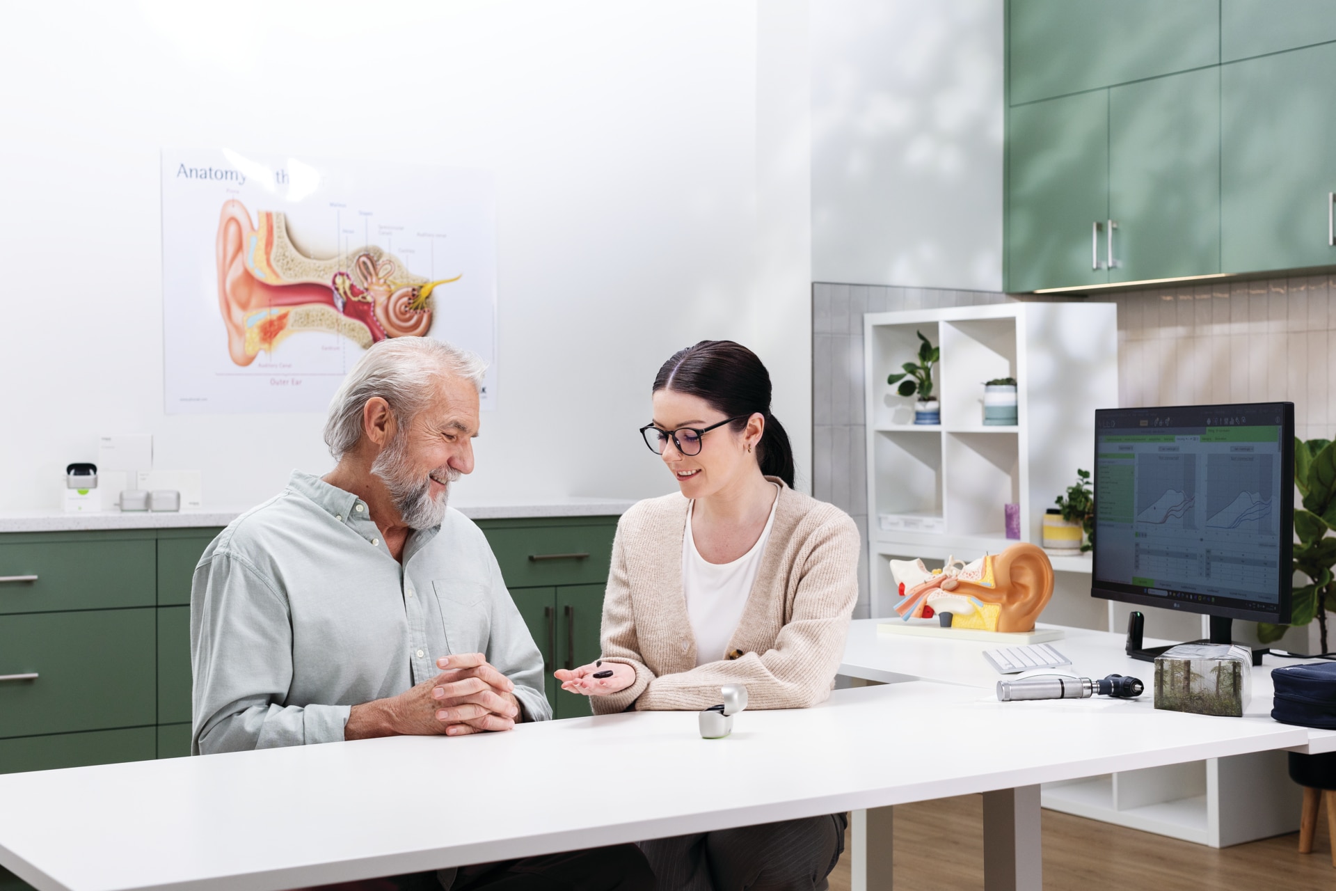 Man and woman looking at tablet together